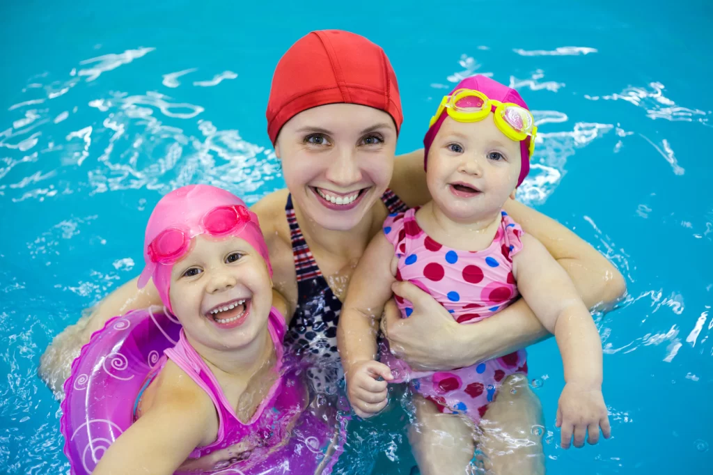 kids with mother in pool